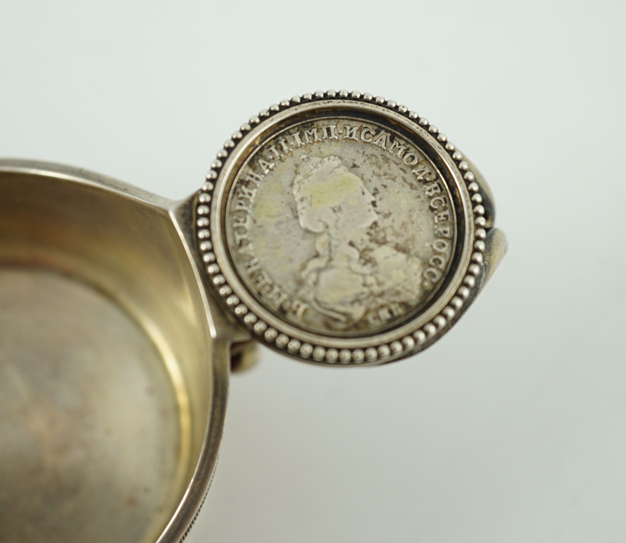CARL FABERGE: A late 19th/early 20th century 88 zolotnik and red guilloche enamel oval kovsh, work master Anders Johan Nevalainen